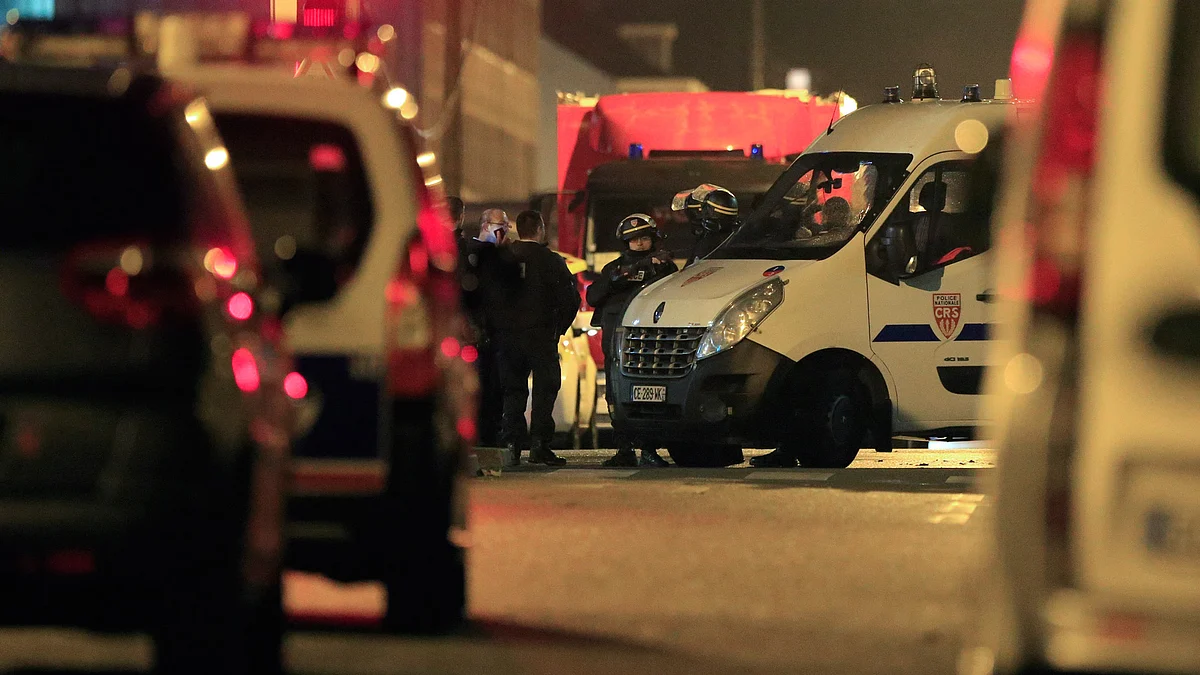 Police outside a building in Roubaix, France where three people were held hostages on November 24. (Photo: Reuters)
