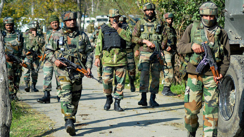 Army personnel in action during an encounter operation against militants in Khandaypora, in Kulgam District of South Kashmir, October 29, 2015. (Photo: PTI)