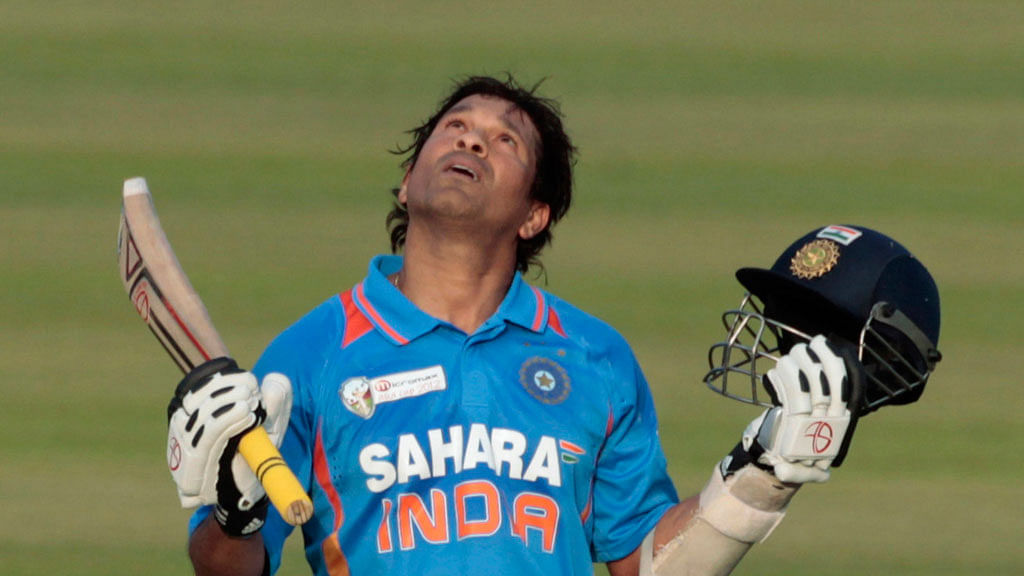 Sachin Tendulkar raises his bat after notching up his hundredth hundred. (Photo: Reuters)&nbsp;