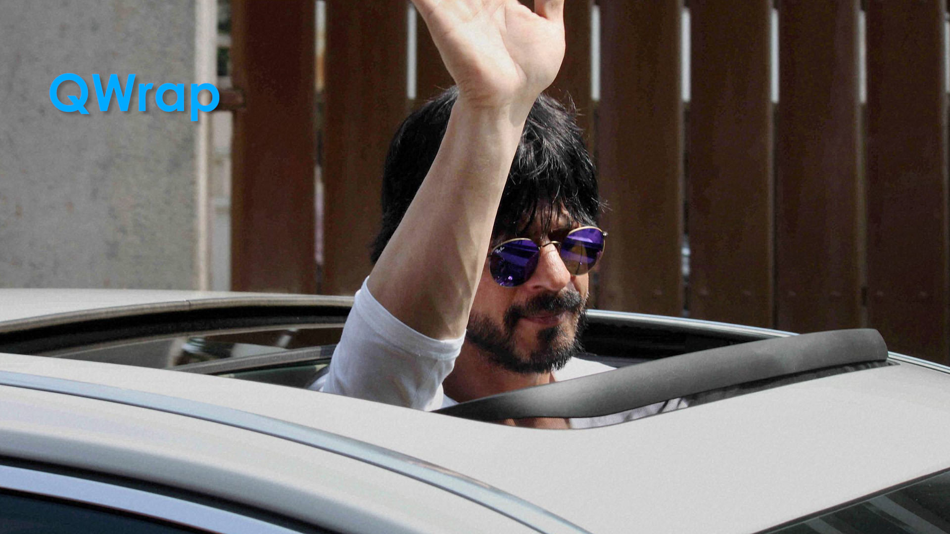 Shah Rukh Khan waves to fans and well-wishers gathered outside his residence to greet him on his 50th Birthday in Mumbai. (Photo: PTI)