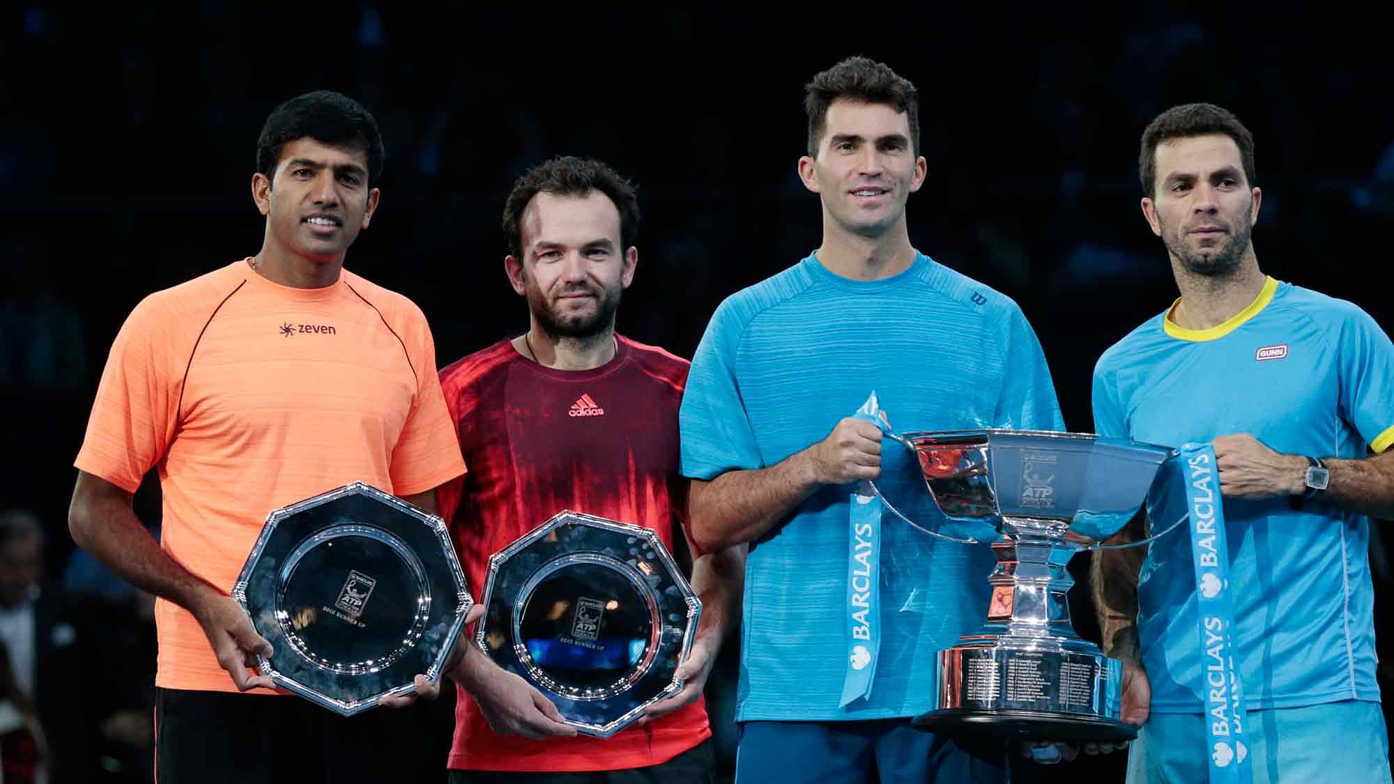 Netherlands’ Jean Julien Rojer and Romania’s Horia Tecau (both in blue) celebrate with runners up  Rohan Bopanna of India  and  Florin Mergea of Romania after winning the final. (Photo: Reuters)