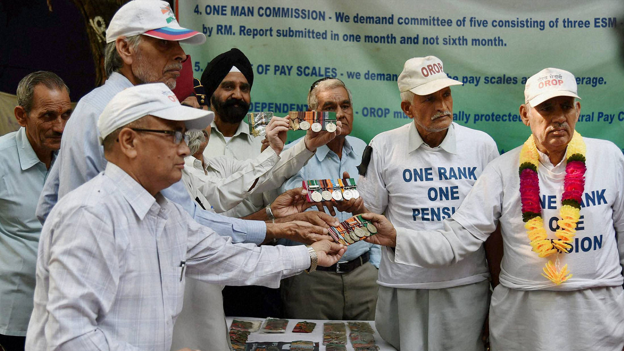 Ex-servicemen start returning their medals during their agitation for One Rank One Pension (OROP) scheme benefits and privileges at Jantar Mantar in New Delhi on Tuesday. (Photo: PTI)