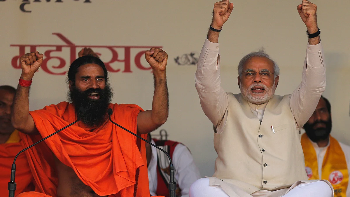 Baba Ramdev (L) with Prime Minister Narendra Modi (R) at a Yoga Festival in New Delhi. (Photo: Reuters)