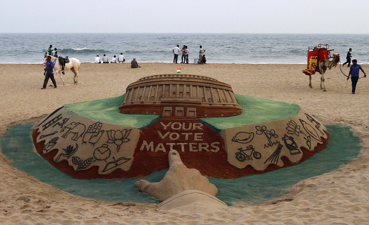 A sand sculpture by artist Sudarshan Patnaik depicts the Indian Parliament with various parties’ election symbols. (Photo: Reuters)