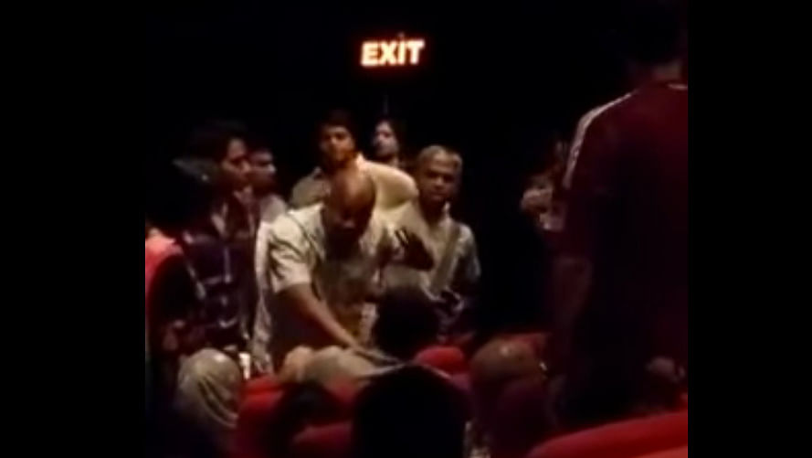 A video has surfaced which purportedly shows a family being asked to leave a theatre for not standing up during the national anthem. (Photo: YouTube Screengrab)