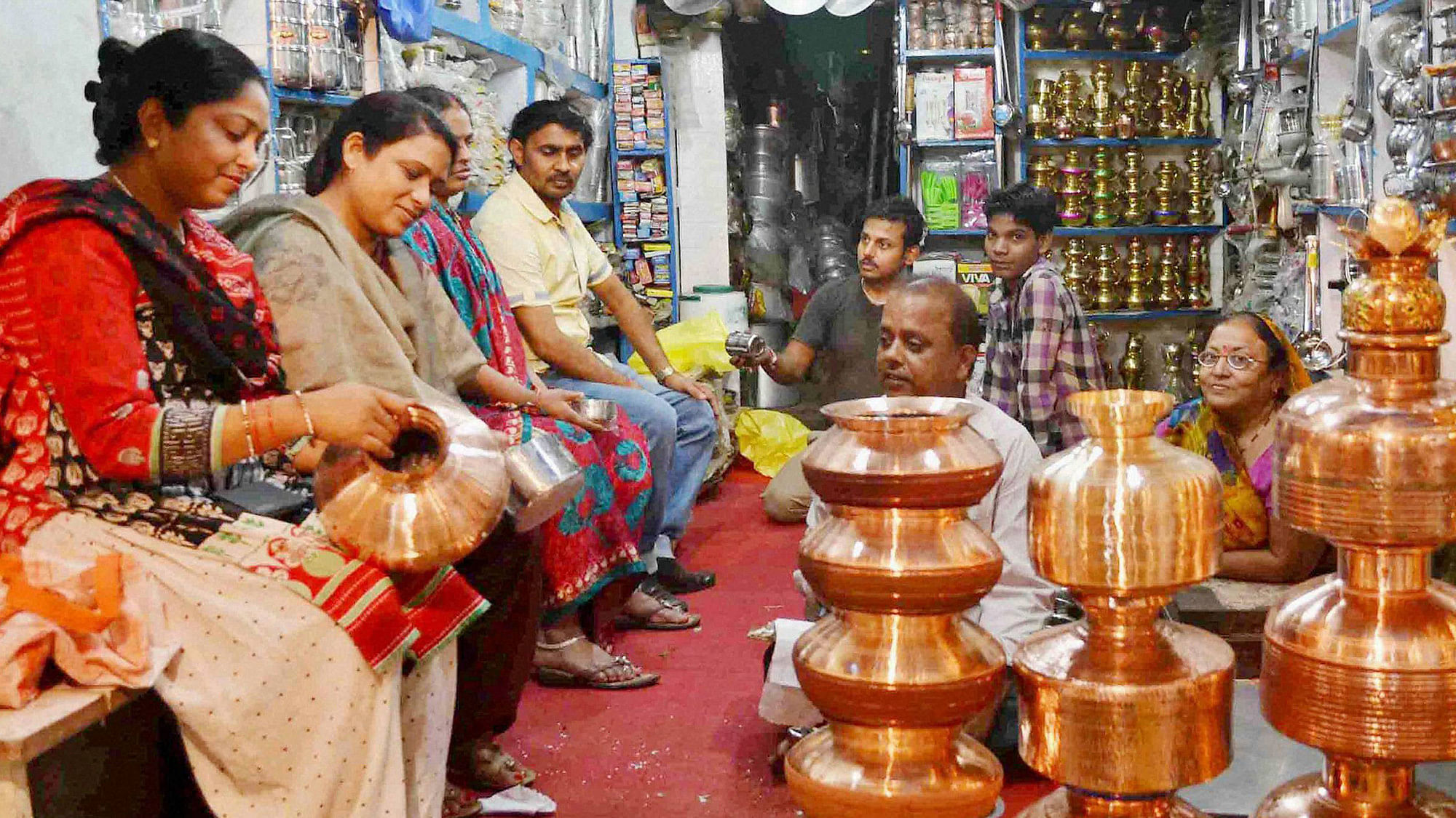 People buying crockery items on the occasion of “Dhanteras” festival in Allahabad on Monday. (Photo: PTI)