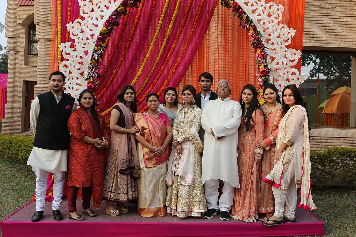 Lalu Prasad Yadav and Rabri Devi with their seven daughters and two sons at the youngest daughter Raj Laxmi’s engagement ceremony in February 2015. (Photo: <b>The Quint</b>)