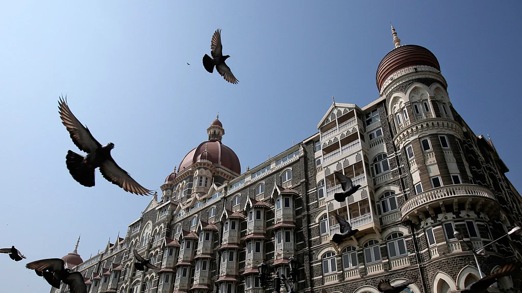 Pigeons fly outside the Taj Mahal Hotel, which was one of the targets of the 26/11 attacks in Mumbai in November 2008. (Photo: Reuters)