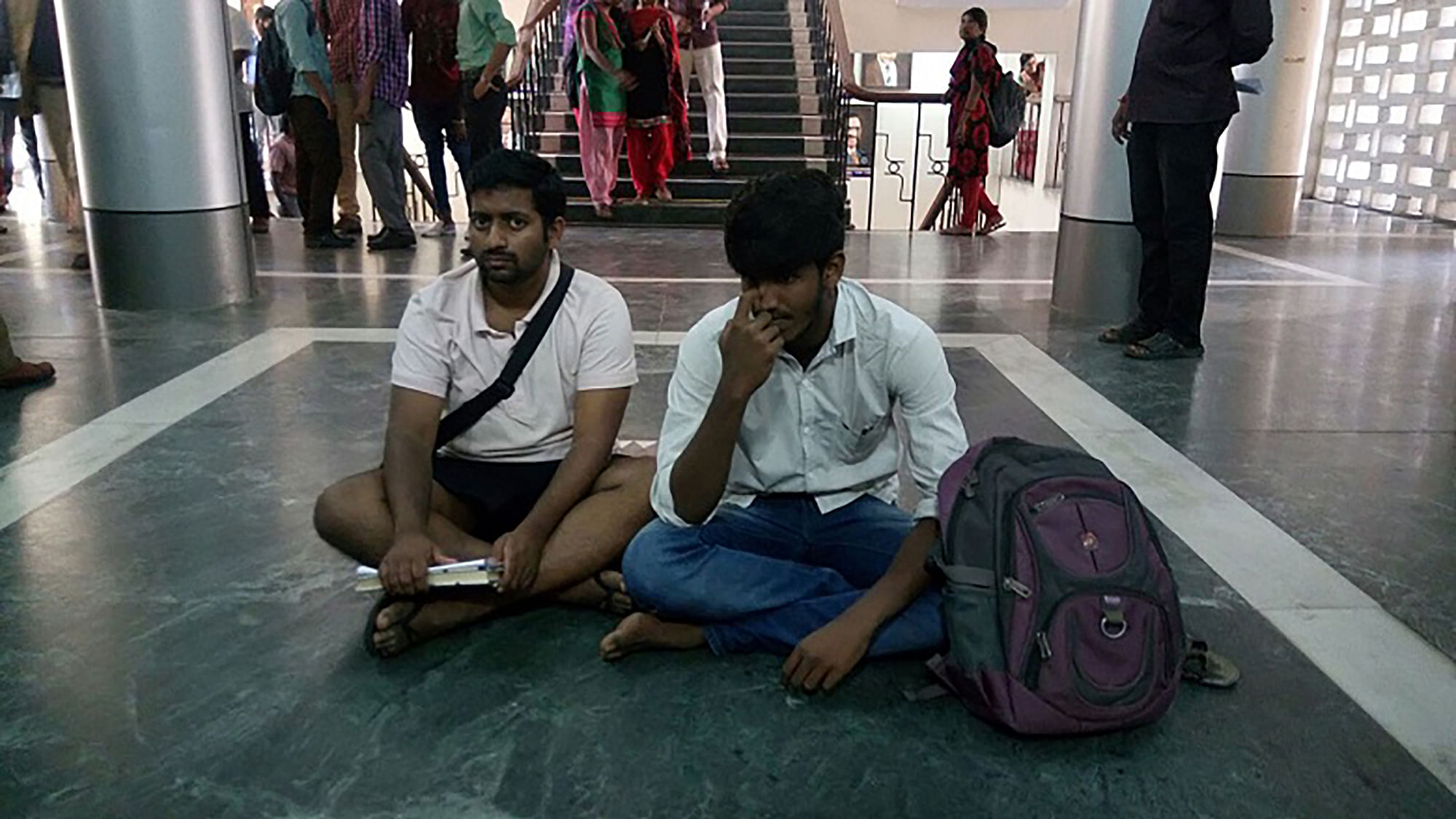 Jonas and another student protesting
outside the VC’s office.





(Photo: TNM)