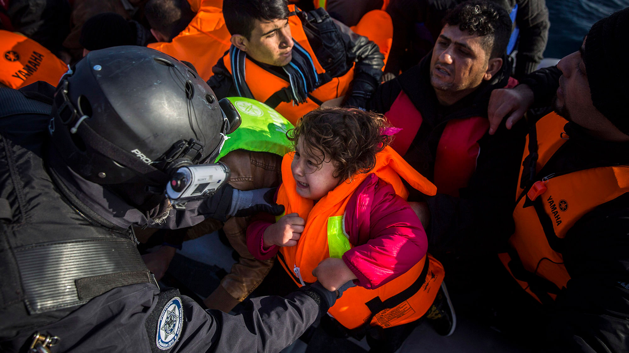 Members of the Frontex, European Border Protection Agency, from Portugal rescue 56 people, who were lost in an open sea as they try to approach in a dinghy on the Greek island of Lesbos, Tuesday, December 8, 2015.  (Photo: Reuters)