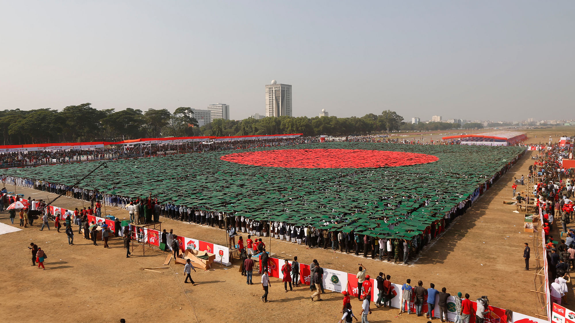 Volunteers form a large flag of Bangladesh as the nation celebrates National Victory Day at the National Parade ground in Dhaka on December 16, 2013. (Photo: Reuters)