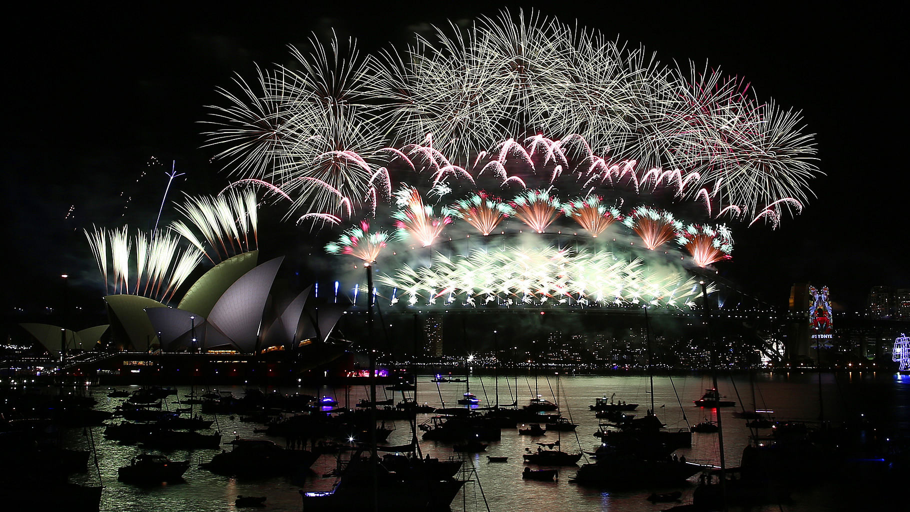 Fireworks explode over the Opera House and Harbour Bridge during pre-New Year’s Eve fireworks display in Sydney, Australia. (Photo: AP)