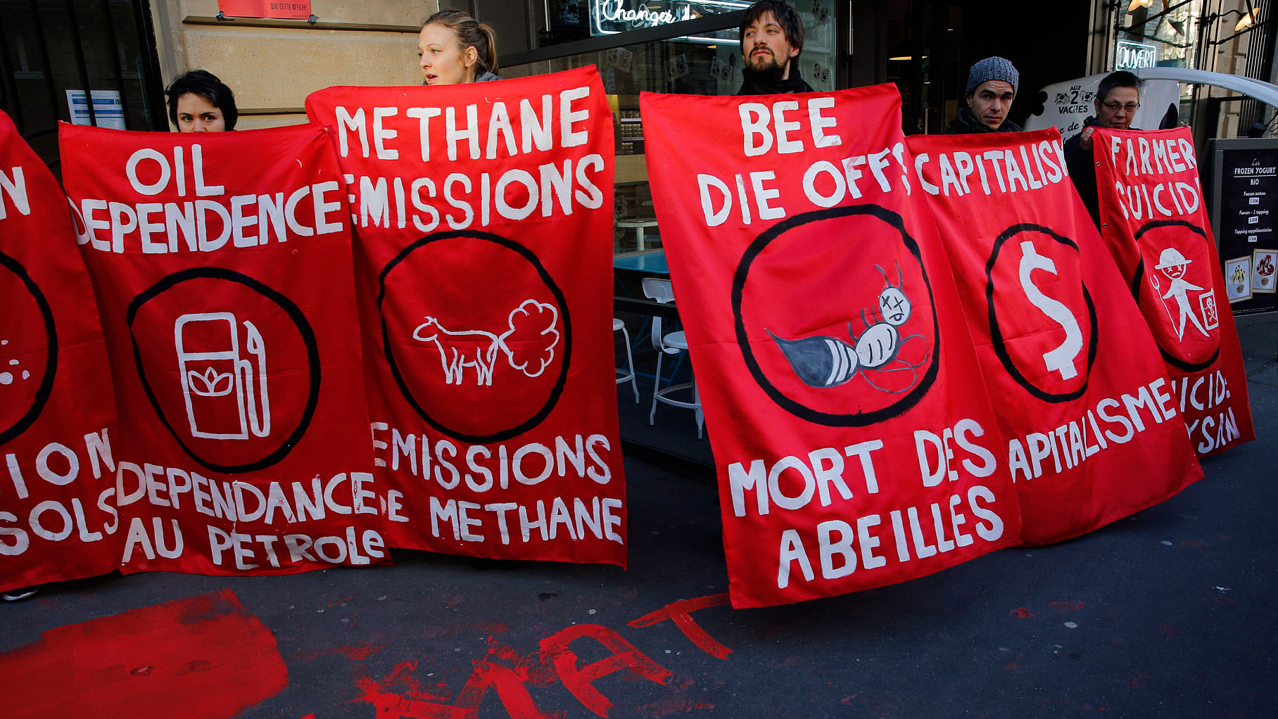 Activists of “Via Campesina” gather during a protest in front of the Headquarters of French food and drink company, Danone, in Paris, December 9, 2015 . The protest is one of many activist actions linked to the COP21.&nbsp;(Photo: AP)