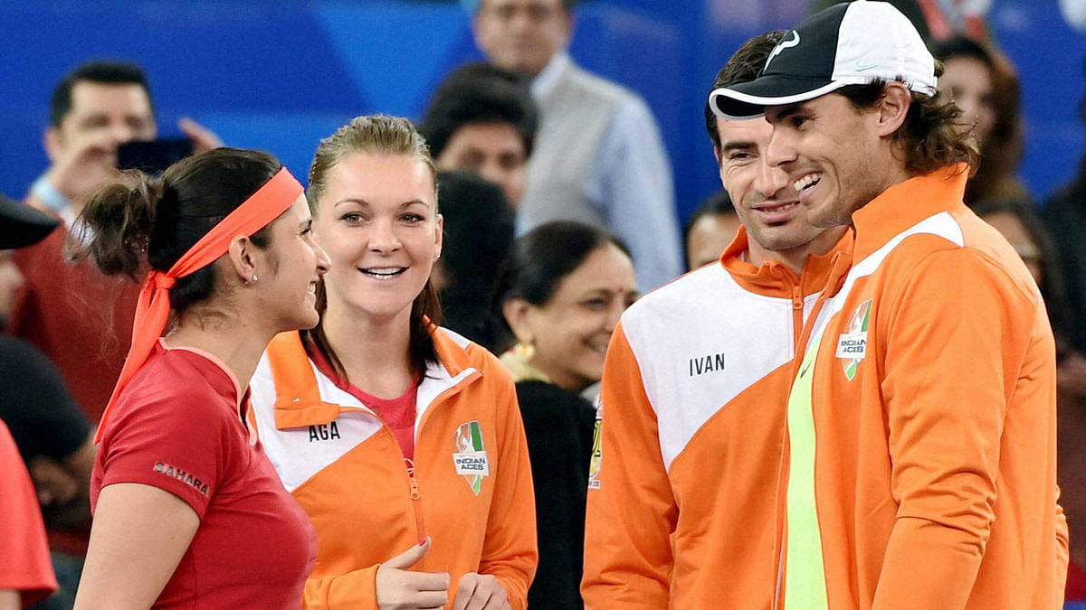Ana Ivanovic dazzles in a saree even as Rafa Nadal schools young kids and grown players in the IPTL on Thursday.