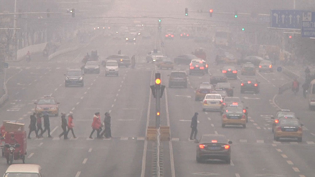 People breathing a highly polluted air in Beijing, China.