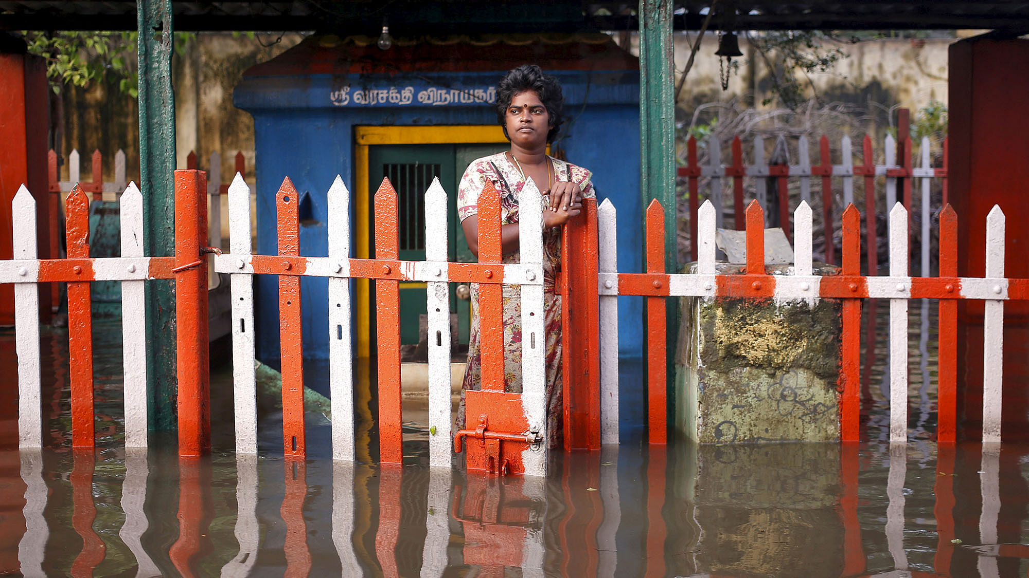 A woman standing submerged after the Chennai flood. (Photo: Reuters)
