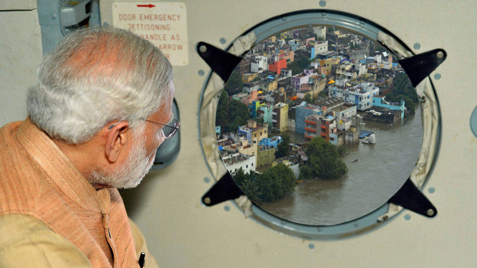 PIB photoshops a picture of PM Modi during his aerial survey of Chennai. (Photo: PTI))