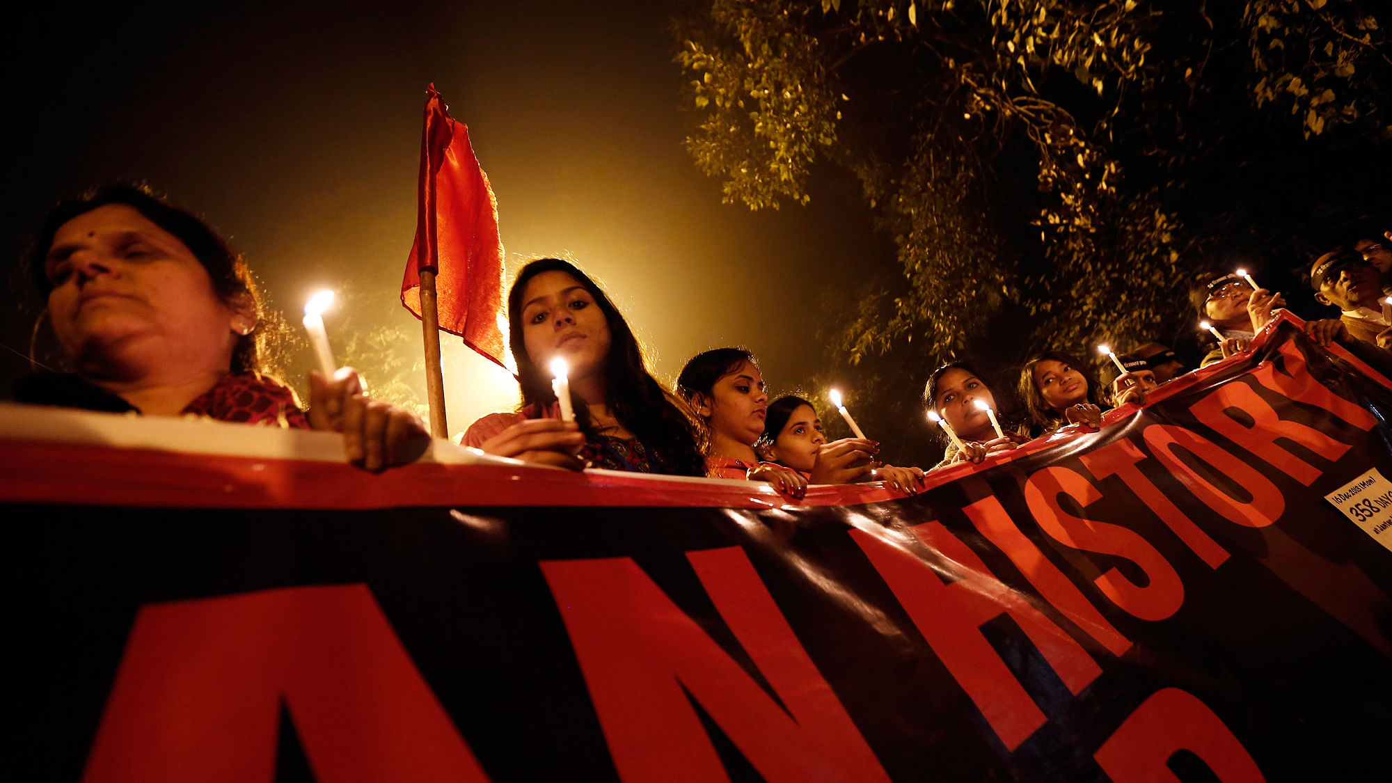 Protestors hold candles during a candle light vigil to mark the first anniversary of the Delhi gang rape, in New Delhi December 16, 2013. (Photo: Reuters)
