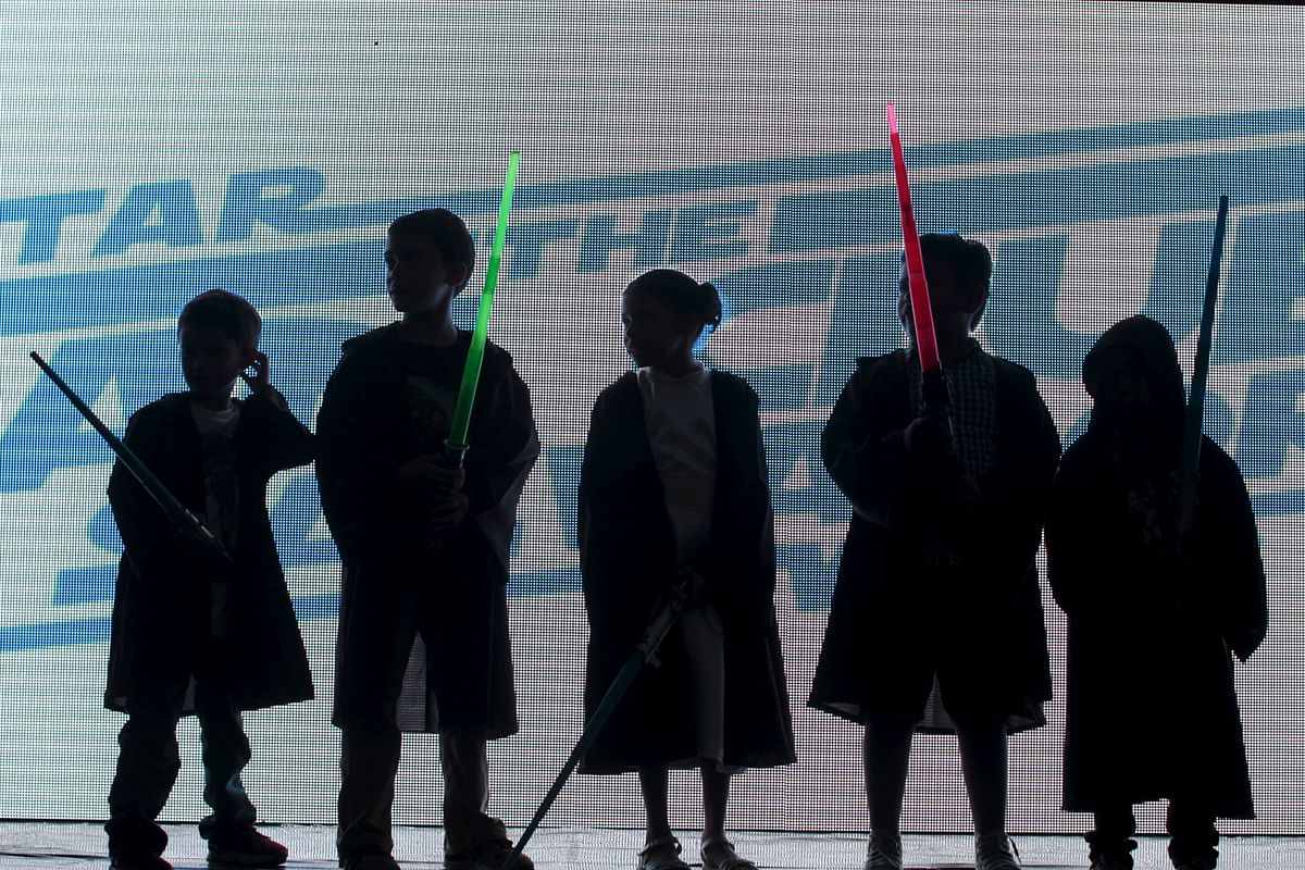 Children dressed as Jedi characters from <i>Star Wars</i> participate in a game during an event held for the release of <i>Star Wars: The Force Awakens</i>. (Photo: Reuters)   