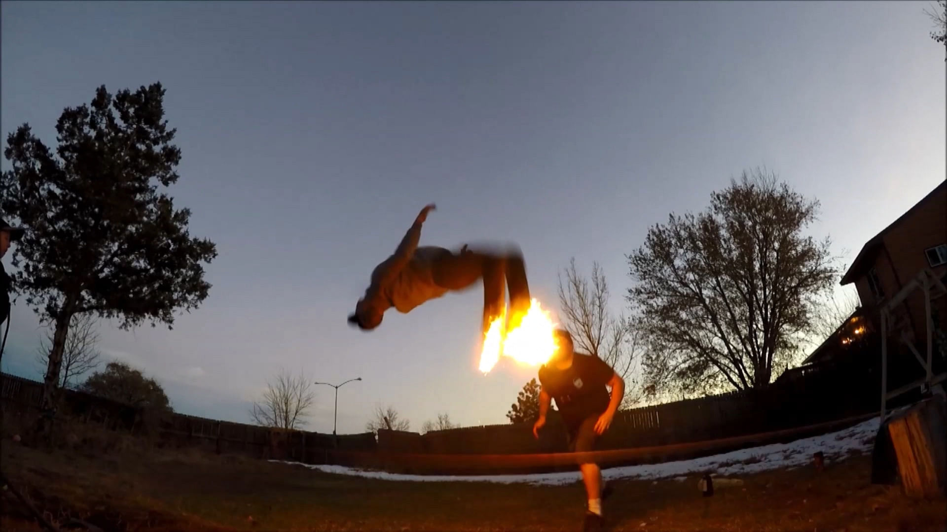 Daredevil Josh Beaudoin performing the deadly somersault with his trainers on fire. (Photo: AP/Caters News screengrab)