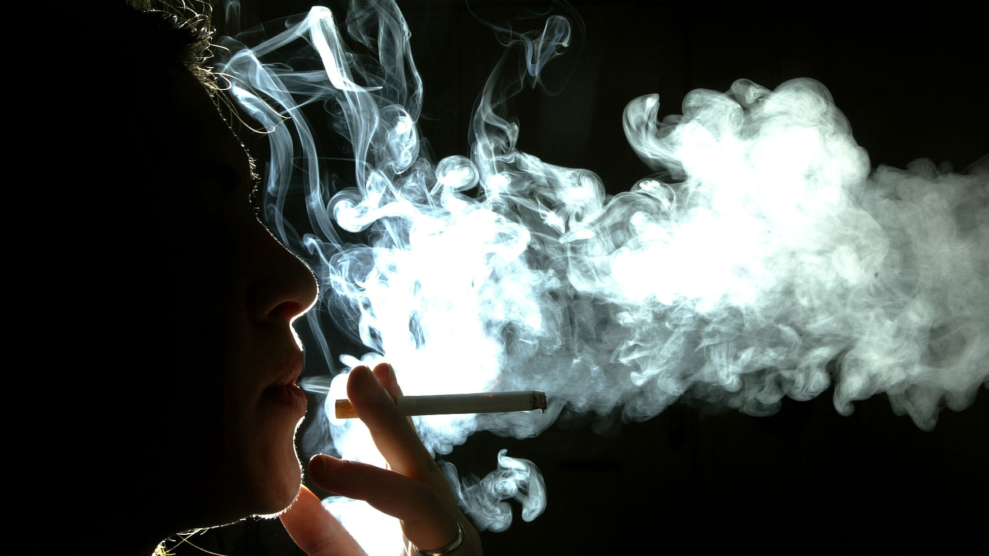 A woman smokes a cigarette. (Photo: Reuters)