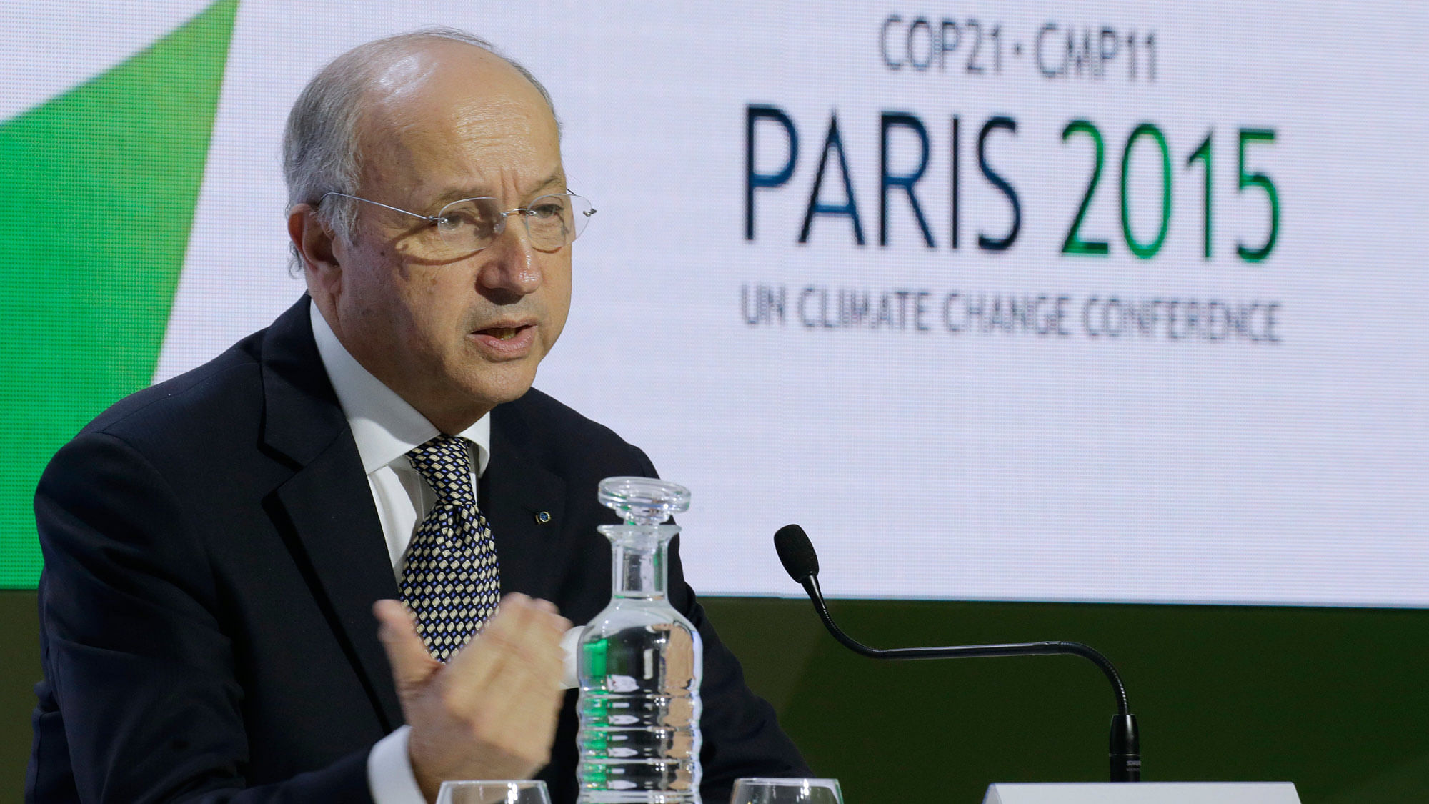 French Foreign Minister Laurent Fabius presents the latest version of the draft at the UN climate summit in Paris. (Photo: Reuters)