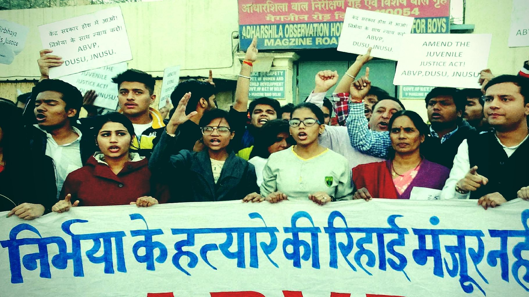 Activists along with Nirbhaya’s mother (second from left) staging a protest against the release of juvenile delinquent in the Nirbhaya case, in New Delhi on Saturday. (Photo: PTI/Altered by The Quint)