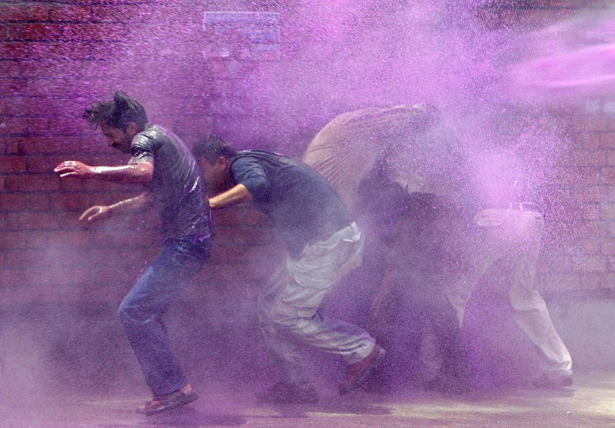 Kashmiri govt employees hit by water cannon during a protest in Srinagar June 10, 2008. (Photo: Reuters)