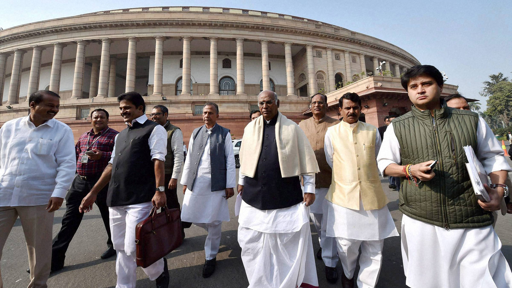  Congress leader Mallikarjun Kharge with party leaders at Parliament house during the winter session in New Delhi. (Photo: PTI)