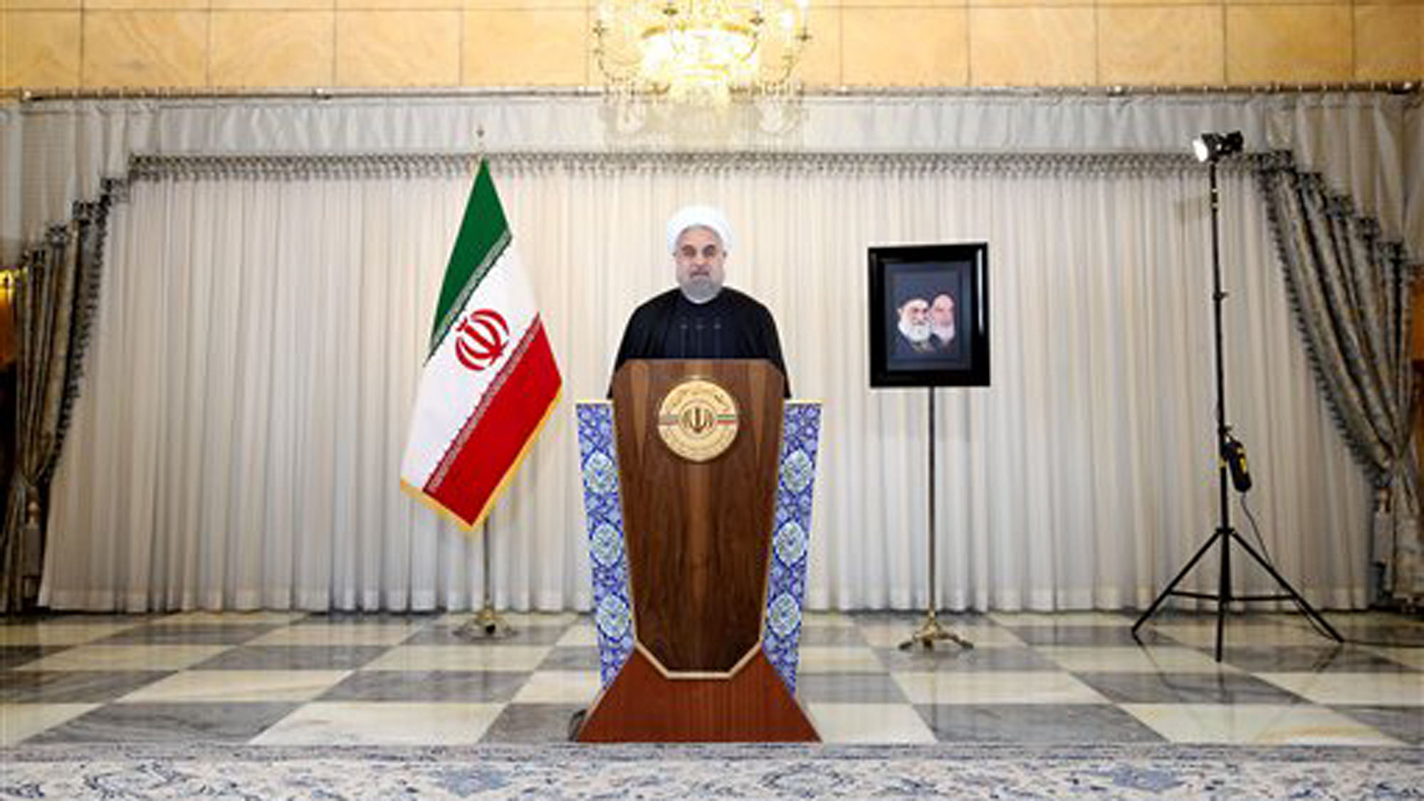 Iran’s President Hassan Rouhani addresses the nation in a televised speech after the closure of Iran’s nuclear probe at the IAEA meeting, at his office in Tehran, Iran, Wednesday, Dec. 16, 2015. (Photo: AP) 