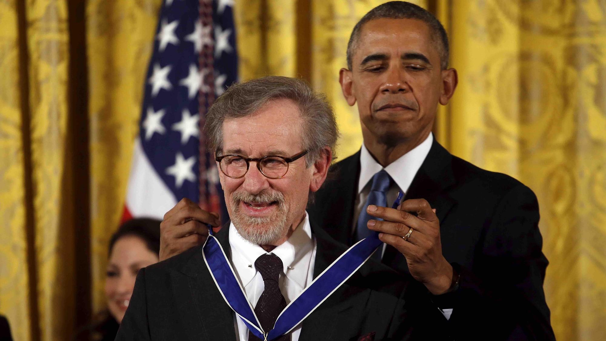 US President Barack Obama presents the Presidential Medal of Freedom to film director Steven Spielberg during an event in the East Room of the White House in Washington on November 24, 2015.