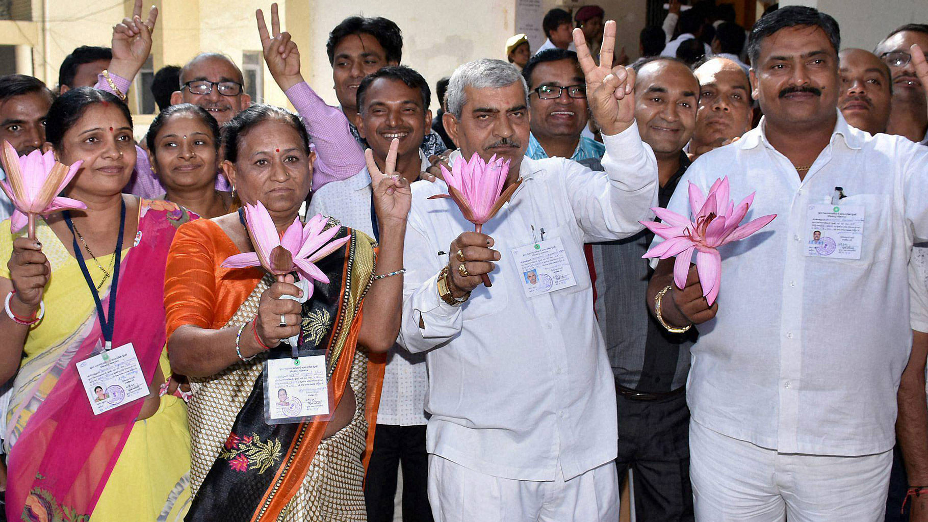 BJP candidates displaying the lotus (party symbol) after their victory in the municipal elections in Surat on Wednesday. (Photo: PTI)