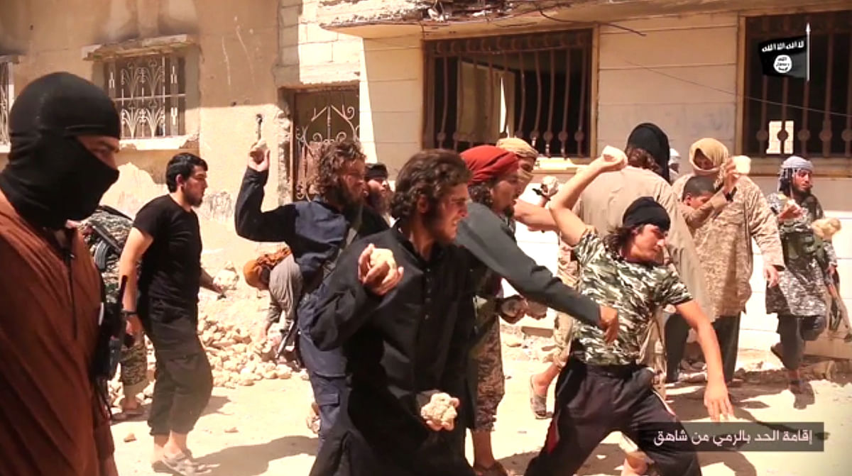  Videos released by the Daesh show militants dangling homosexual men over buildings tops to drop them head-first . 