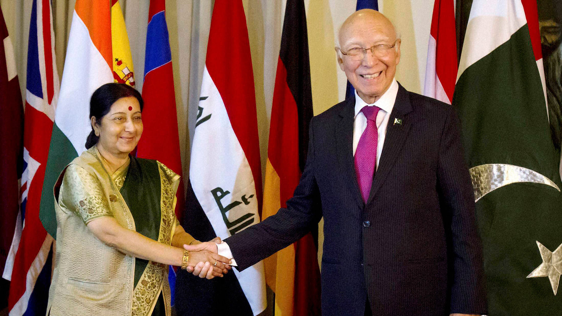 

External Affairs Minister Sushma Swaraj shakes hands with Pakistan’s Foreign Affairs Adviser Sartaj Aziz before a meeting in Islamabad on Wednesday. (Photo: PTI)
