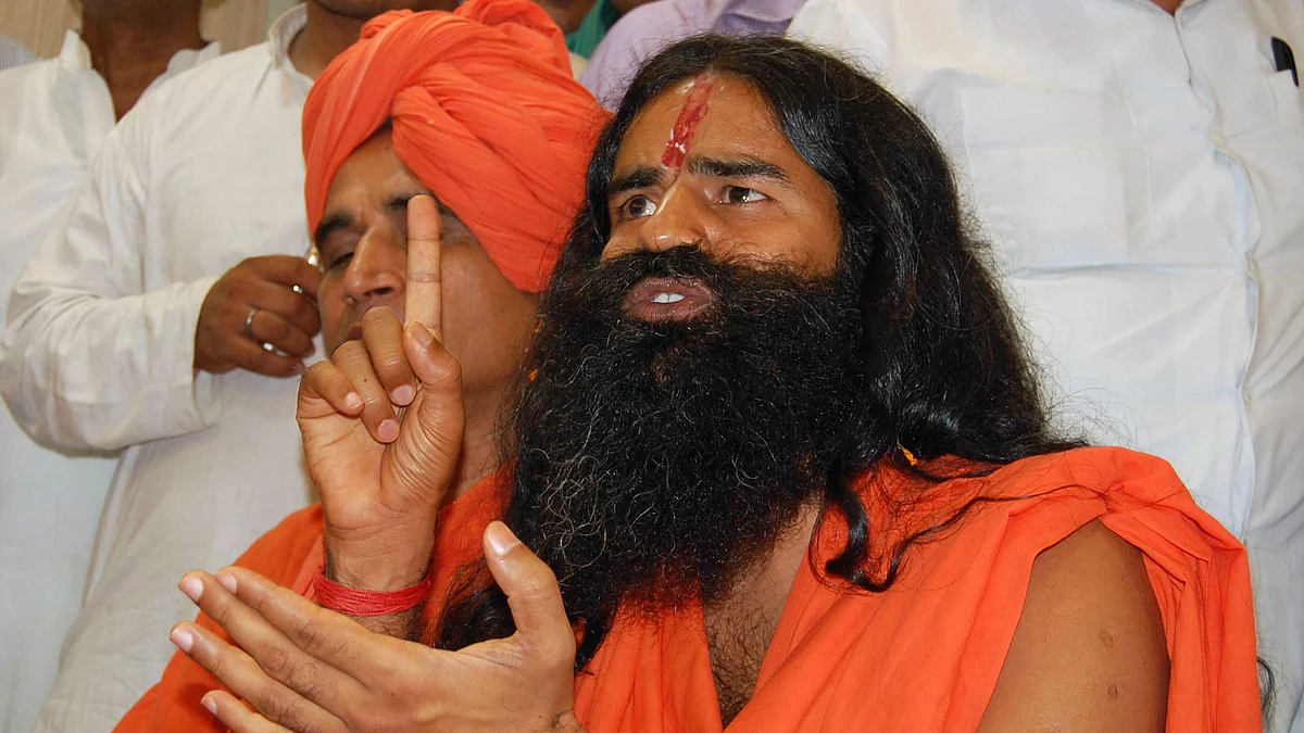 Haryana has made Baba Ramdev the state’s brand ambassador. He frequently appears on stage, practising yoga alongside Khattar. (Photo: Reuters)