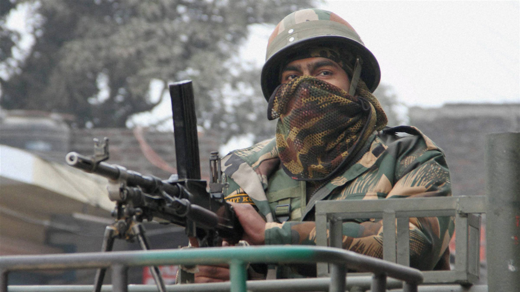  An army person stands guard during the operation against militants at the Indian Air Force base in Pathankot on Monday. (Photo: PTI)