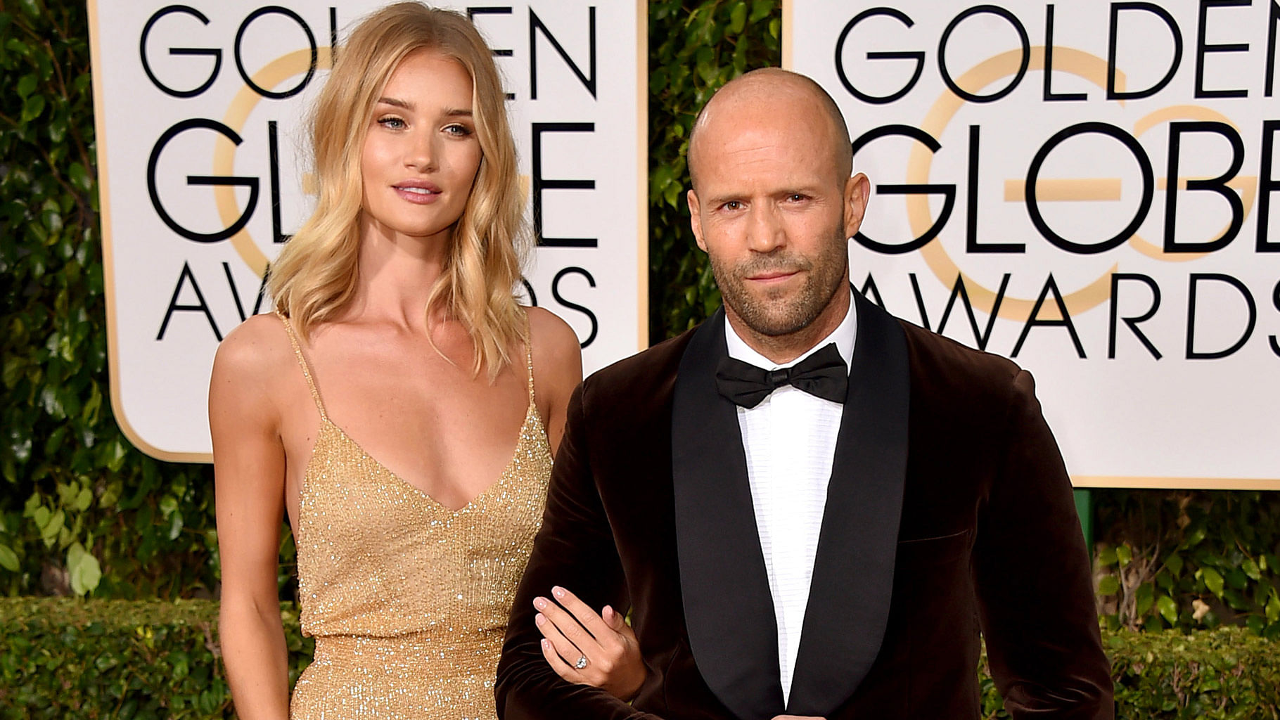 British model and actress Rosie Huntington-Whiteley, left, and Jason Statham arrive at the 73rd annual Golden Globe Awards in Los Angeles. (Photo: AP)&nbsp;