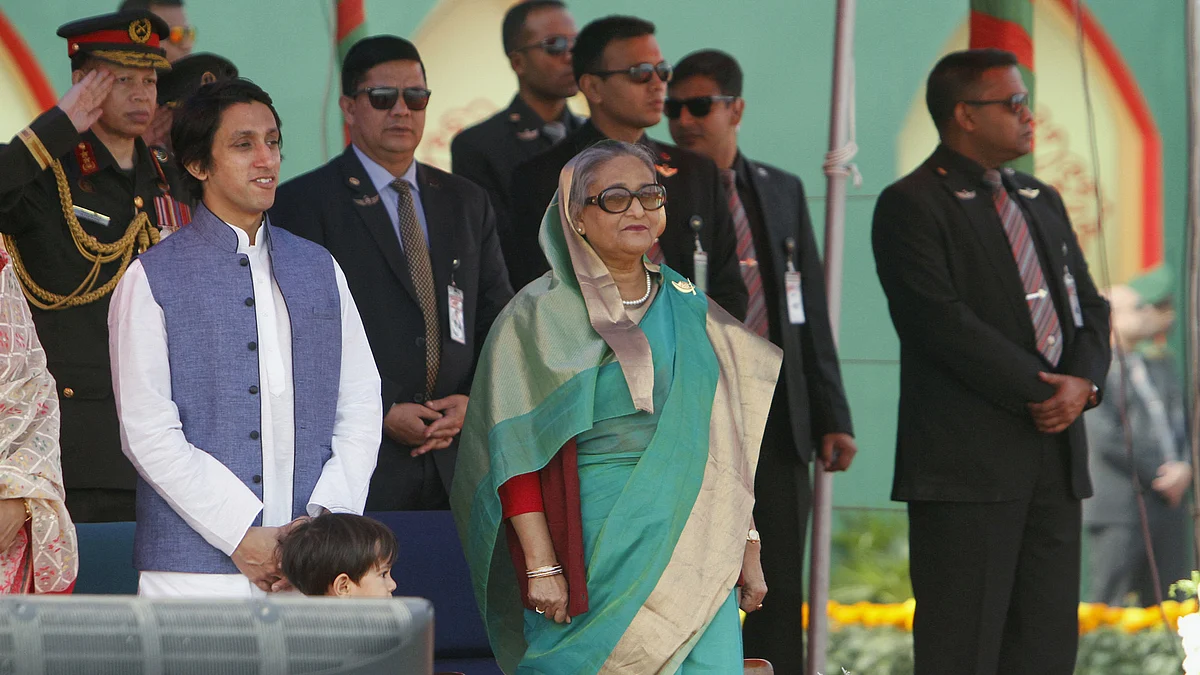 Bangladesh’s Prime Minister Sheikh Hasina stands along with army officers for the national anthem during the celebration of the country’s 45th Victory Day in Dhaka, December 16, 2015. (Photo: Reuters)
