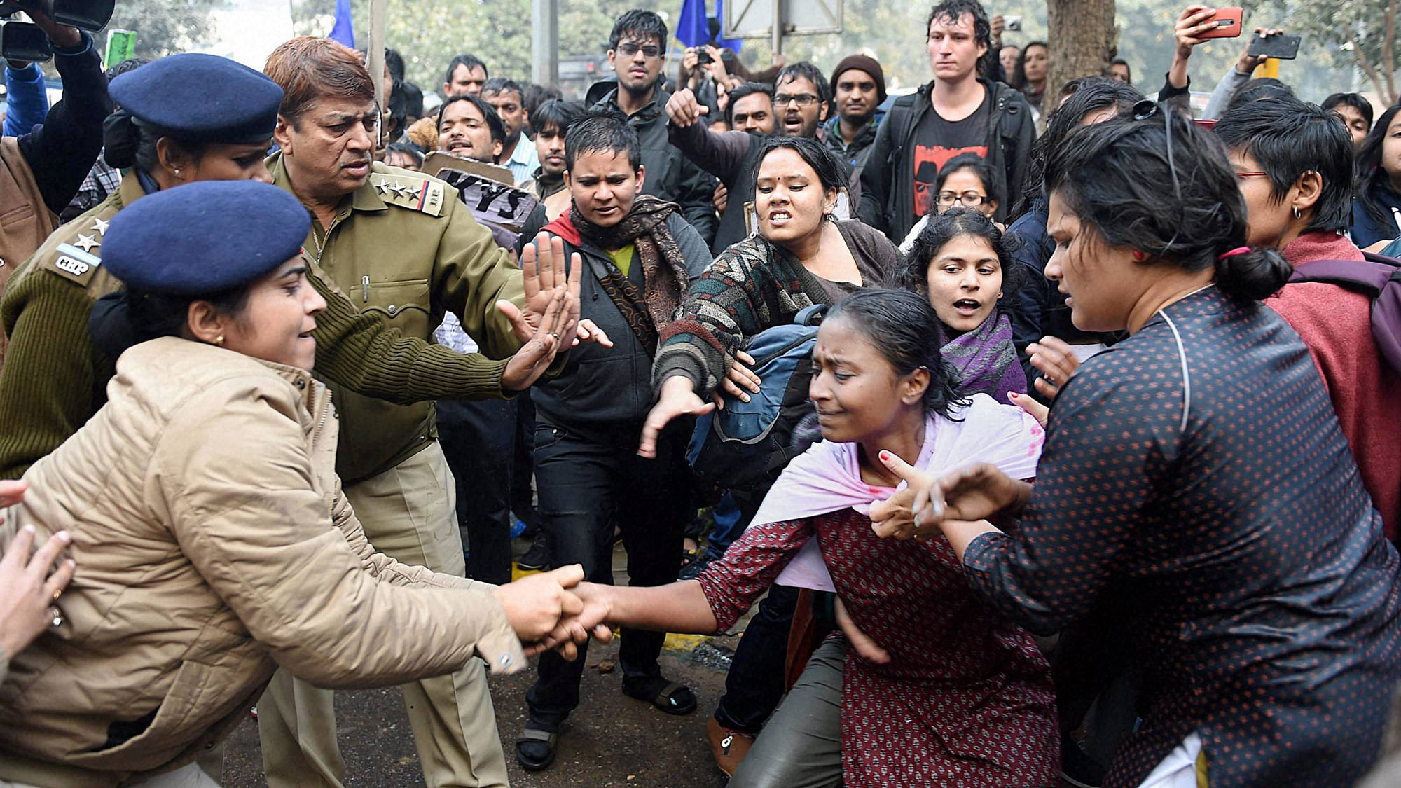 Police detain a girl students during a protest against the Ministry of Human Resource Development in New Delhi on Monday over the suicide of a PhD scholar Rohith Vemula at University of Hyderabad.&nbsp;(Photo: PTI)