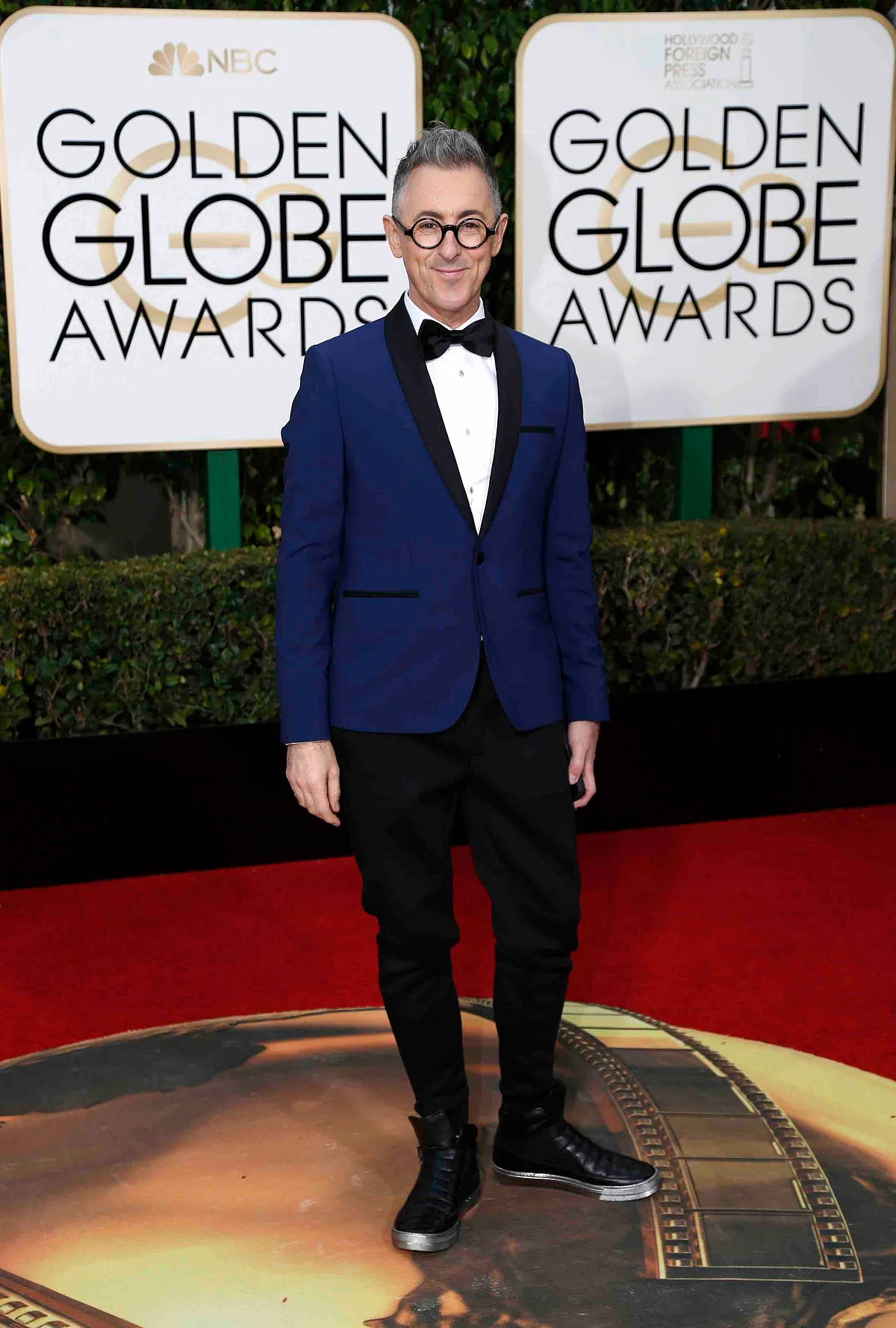 Alan Cumming in the indigo blue jacket brought a refreshing change to the red carpet (Photo: Reuters)