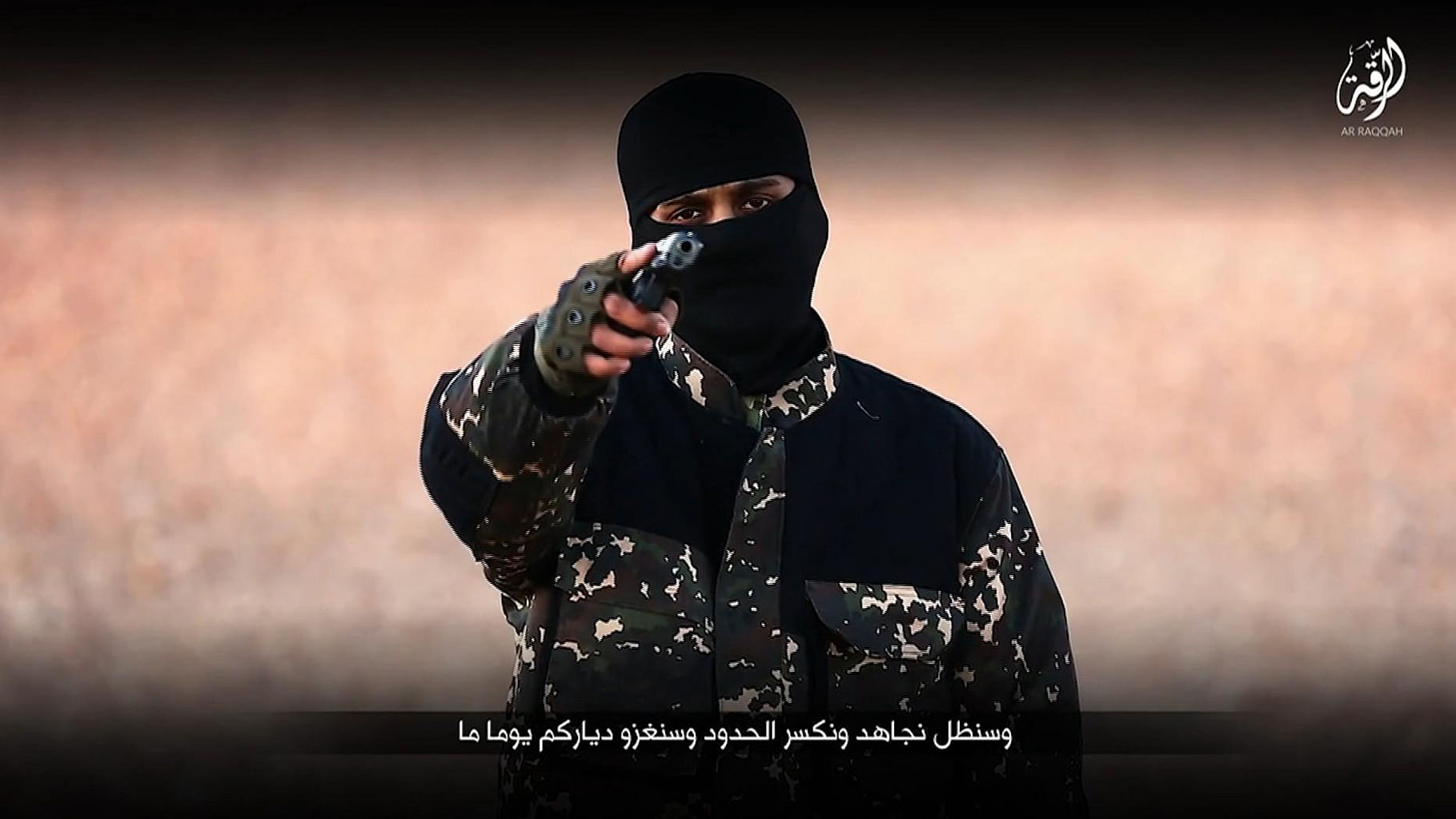 This snapshot from the video shows an ISIS member brandishing a gun and talking to the camera. (Photo: AP)&nbsp;