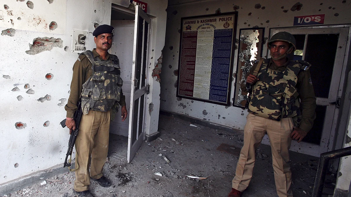 Security personnel stand guard after an attack on a police camp at Kathua district, south of Jammu. (Photo: Reuters)