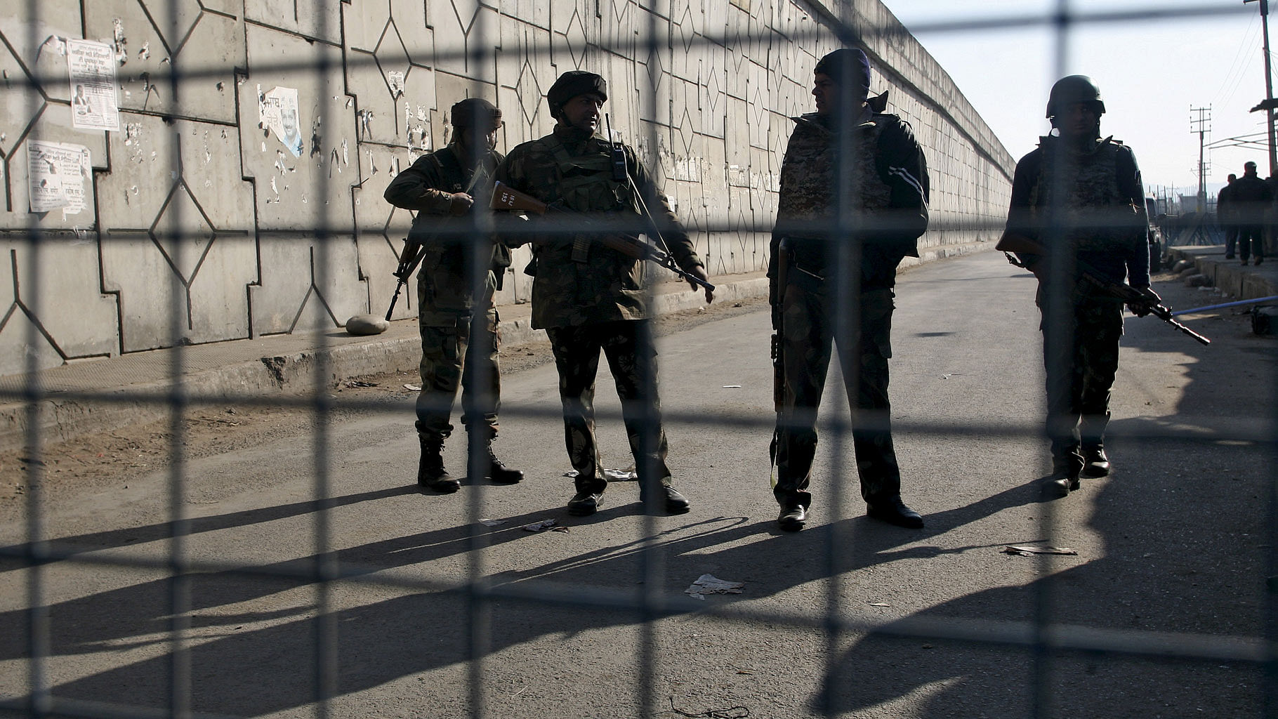 Security personnel stand guard outside the IAF air base in Pathankot. (Photo: Reuters)