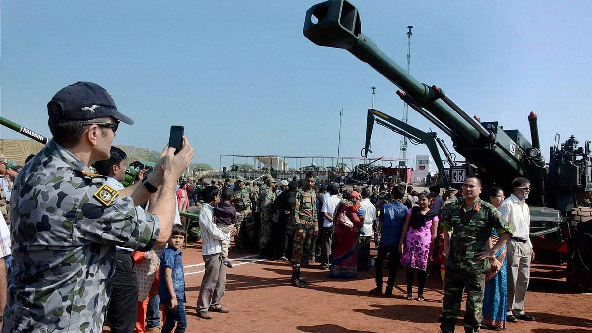 An Air Force officer takes photograph during the firepower exercise ‘Sarvatra Prahar’ at Devlali, Nasik district of Maharashtra. (Photo: PTI)