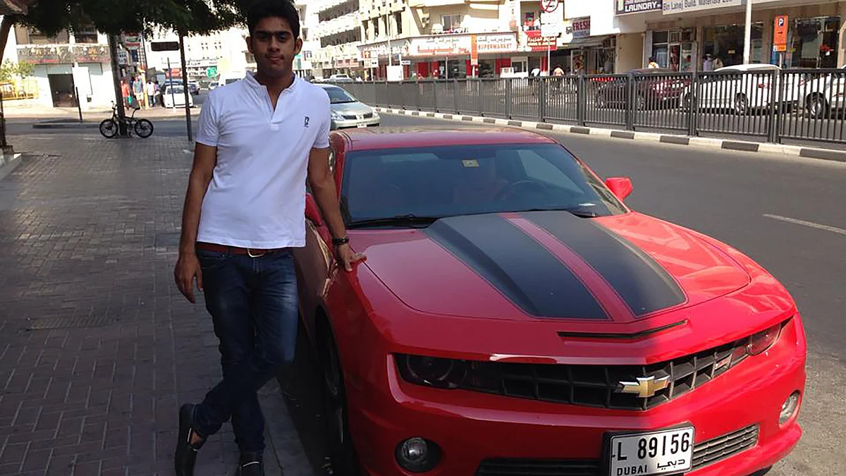 Ambia posing with a red American muscle car, Chevrolet Camaro.
(Photo: <a href="https://www.facebook.com/photo.php?fbid=534143366654050&set=a.303481266386929.65638.100001751742452&type=3&theater">Facebook</a>)