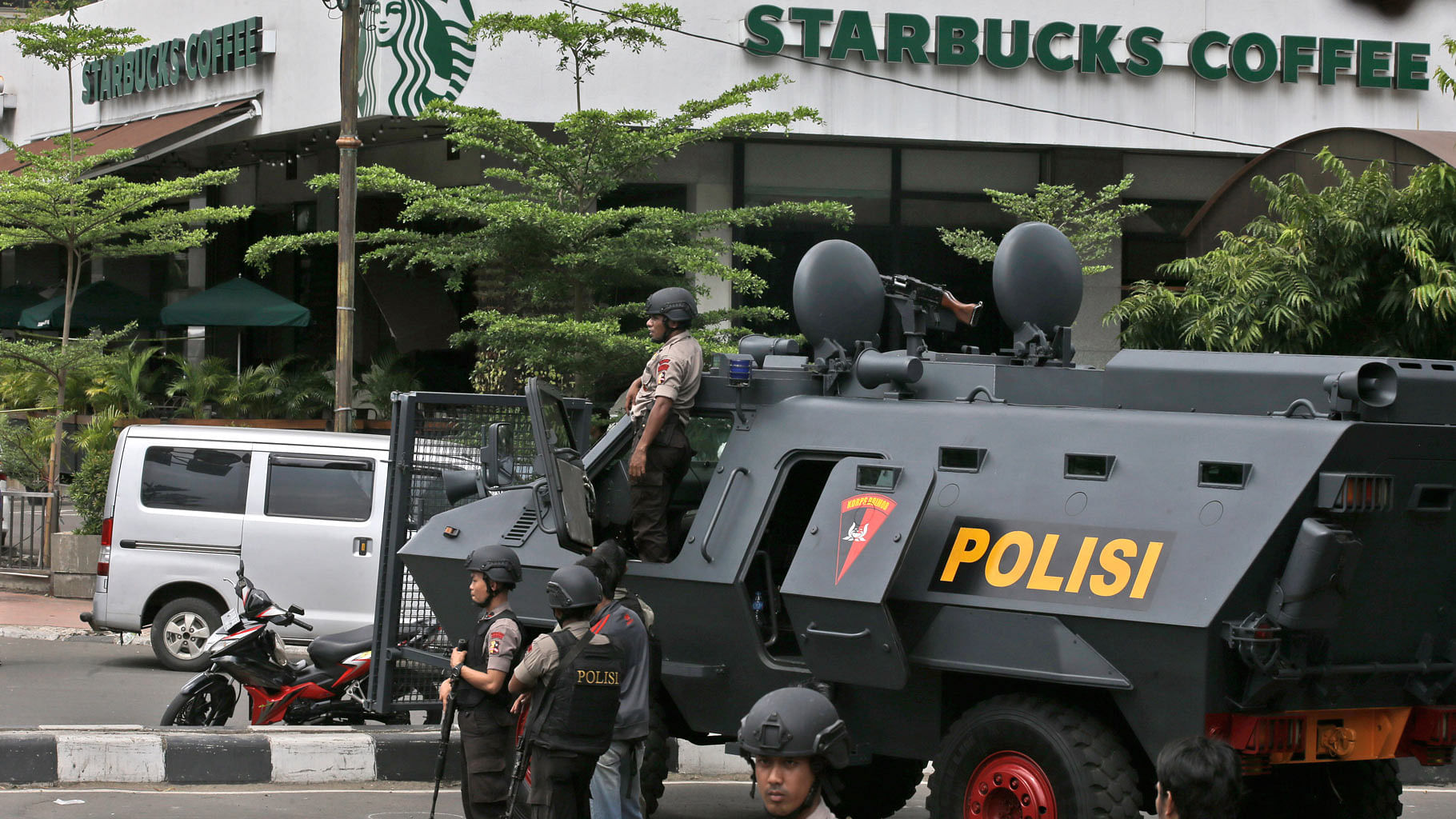A police armoured vehicle parked outside a Starbucks cafe after the explosion in Jakarta, Indonesia. (Photo: AP)