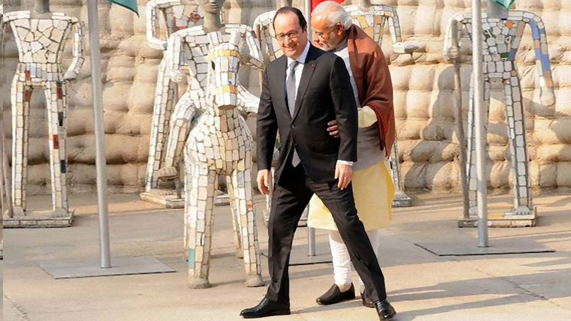 The awkward ‘hug’. (Photo Courtesy: <i><a href="http://www.gqindia.com/get-smart/personalities/narendra-modi-just-wants-a-hug/">GQ India</a></i>)