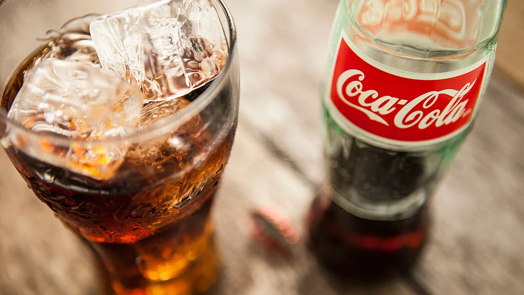Within 20 minutes of drinking Coke, your blood sugar spikes, causing an insulin burst. (Photo: iStockphoto)