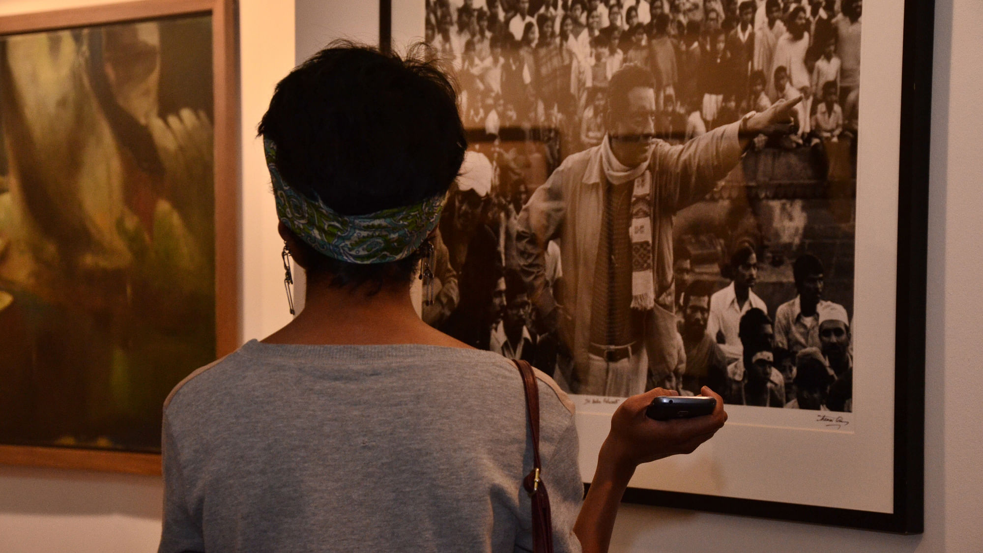 A woman looks at a piece of artwork featured at last year’s India Art Fair. 