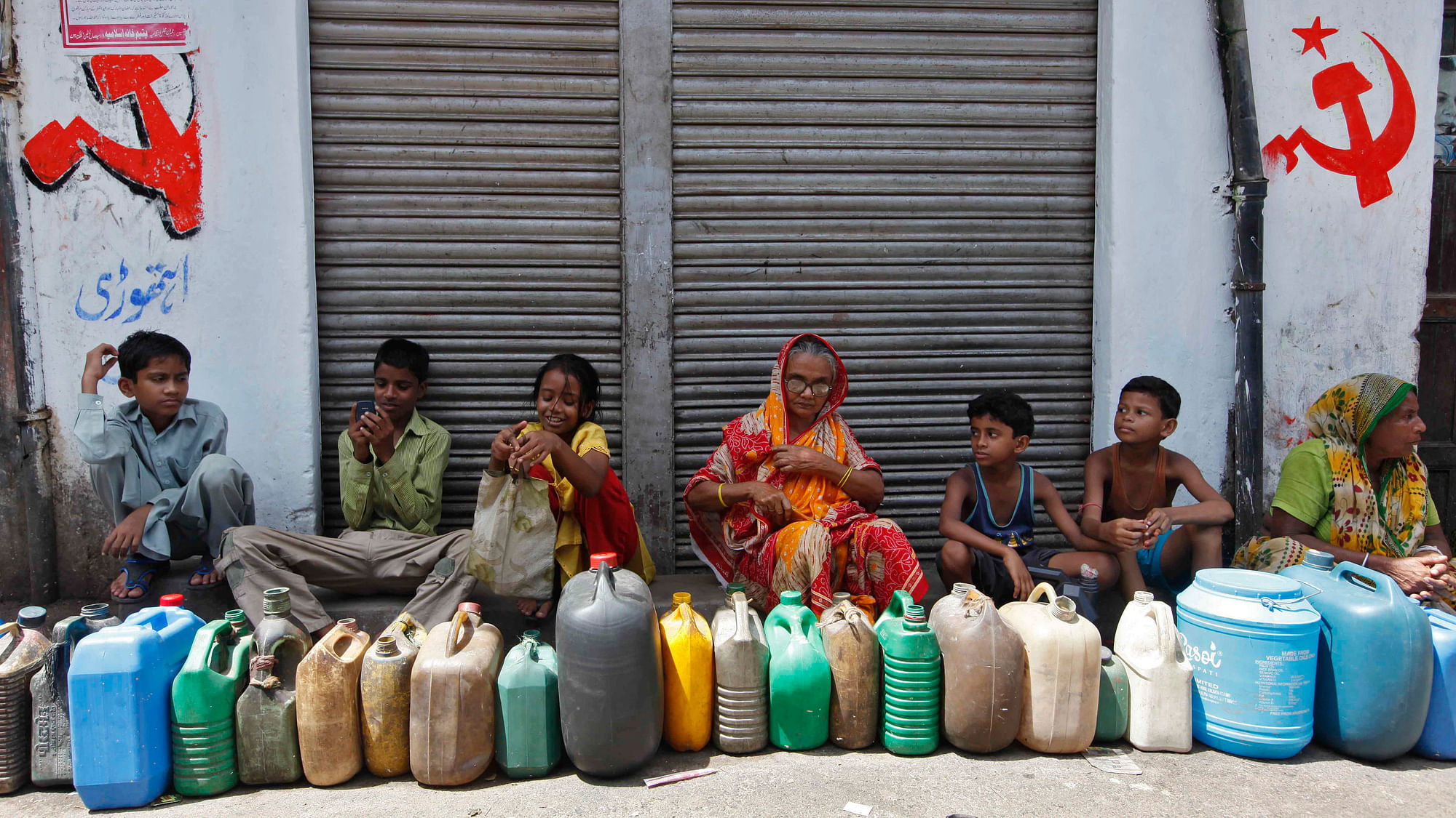 File photo of people waiting outside a closed ration shop to buy kerosene. Image used for representational purposes.